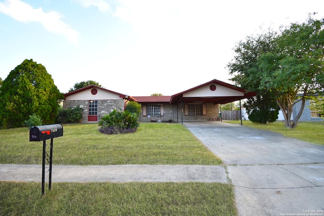 ranch-style house with a front lawn and a carport