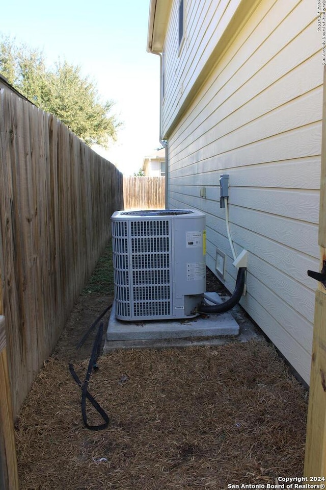 exterior details with wood walls and cooling unit