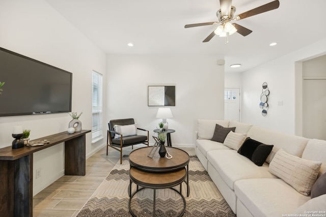 living room featuring light hardwood / wood-style floors and ceiling fan