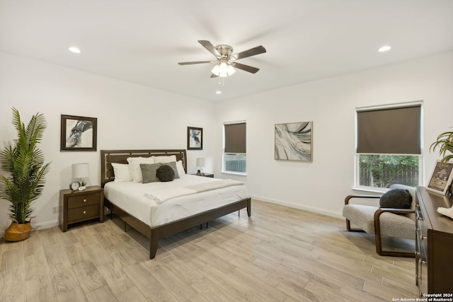 bedroom with light wood-type flooring and ceiling fan