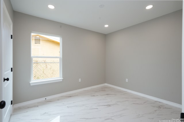 spare room with plenty of natural light