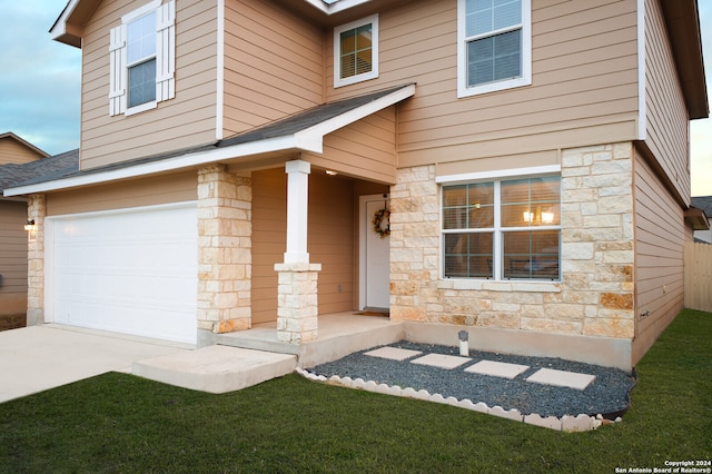 view of front of property featuring a garage