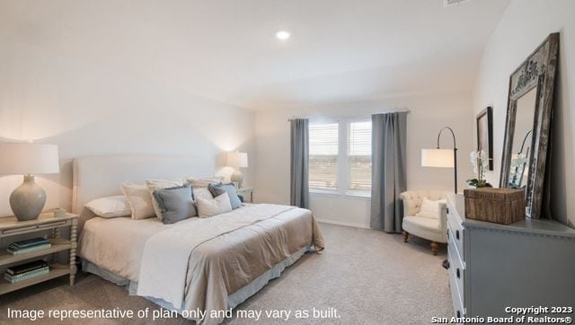 bedroom featuring light colored carpet