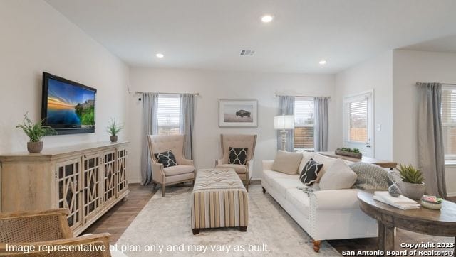 living room with light hardwood / wood-style floors