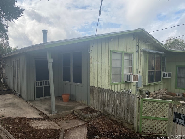 view of home's exterior with cooling unit