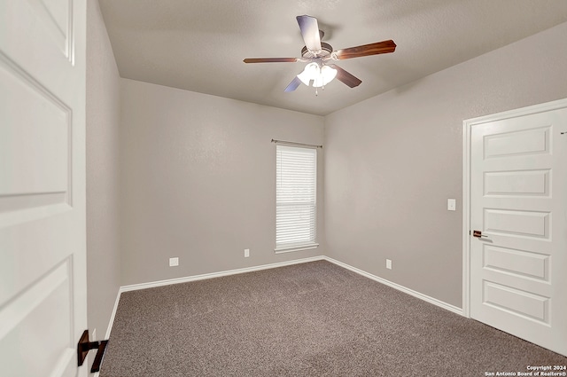 carpeted empty room featuring ceiling fan