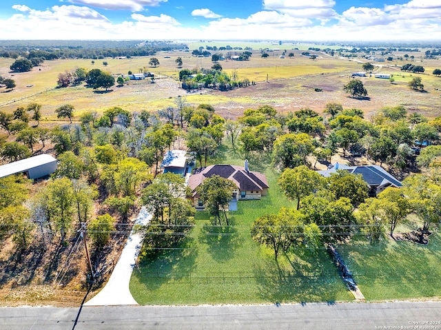 birds eye view of property with a rural view