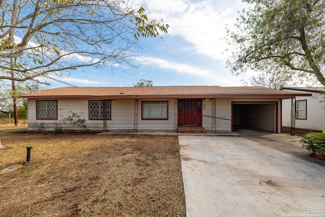 single story home featuring a garage