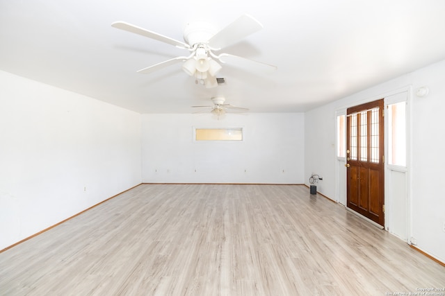 unfurnished room with light hardwood / wood-style floors and ceiling fan