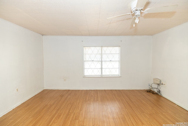 unfurnished room featuring hardwood / wood-style floors and ceiling fan