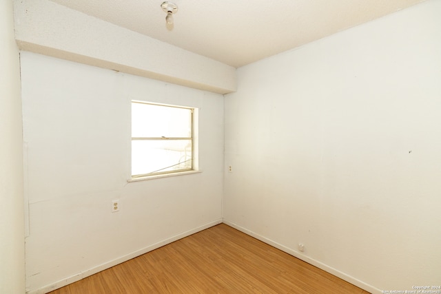 unfurnished room featuring wood-type flooring