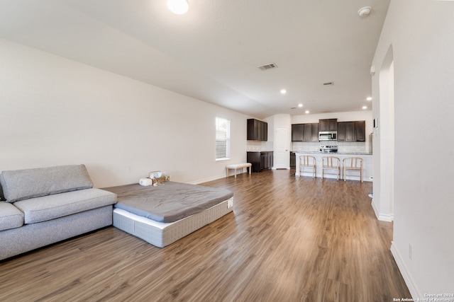 unfurnished living room featuring hardwood / wood-style floors