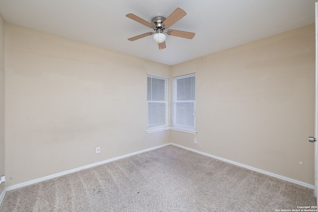 empty room featuring ceiling fan and carpet floors