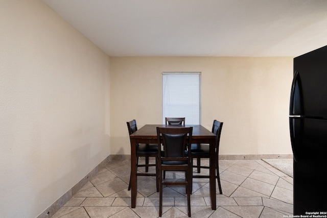 dining area with light tile patterned flooring