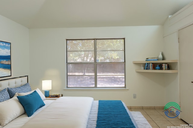 bedroom with light tile patterned flooring