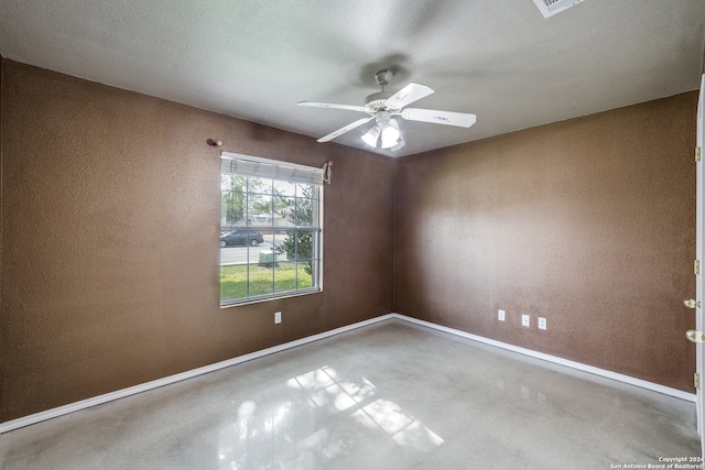 spare room featuring a textured ceiling and ceiling fan