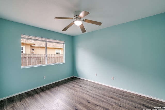 empty room featuring wood-type flooring and ceiling fan