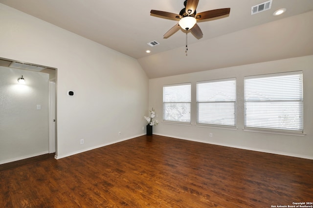 spare room with lofted ceiling, dark hardwood / wood-style floors, and ceiling fan