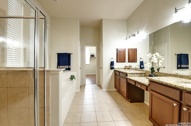 bathroom featuring vanity, tile patterned flooring, and plus walk in shower