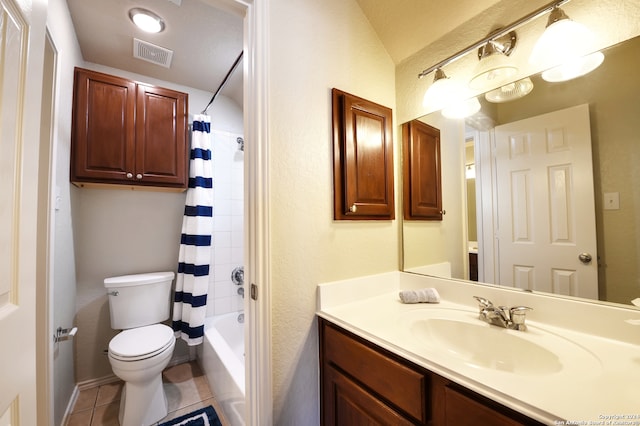 full bathroom featuring toilet, shower / tub combo with curtain, vanity, and tile patterned flooring