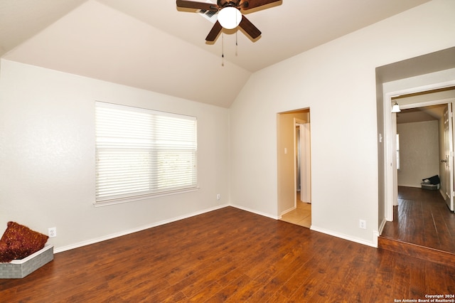 unfurnished room with ceiling fan, lofted ceiling, and dark hardwood / wood-style floors