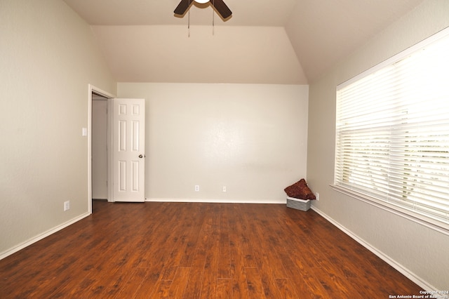 spare room featuring ceiling fan, lofted ceiling, and dark hardwood / wood-style floors