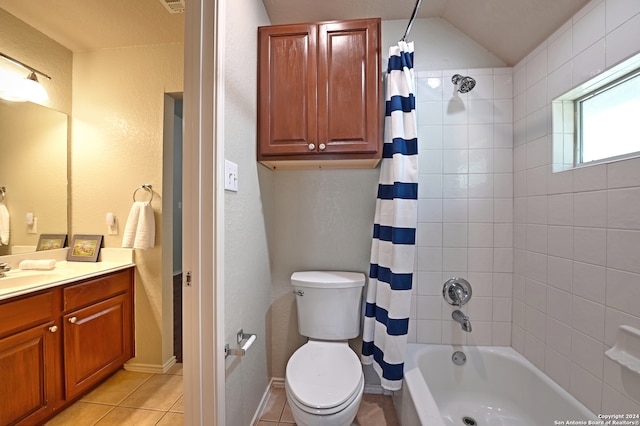 full bathroom with tile patterned flooring, vanity, shower / bath combo, toilet, and vaulted ceiling