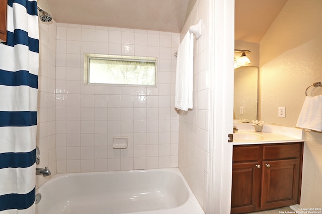 bathroom with vanity and shower / tub combo with curtain