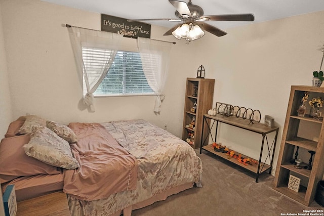 bedroom with ceiling fan and carpet floors