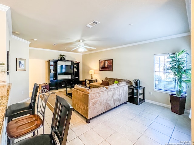 tiled living room with ornamental molding and ceiling fan