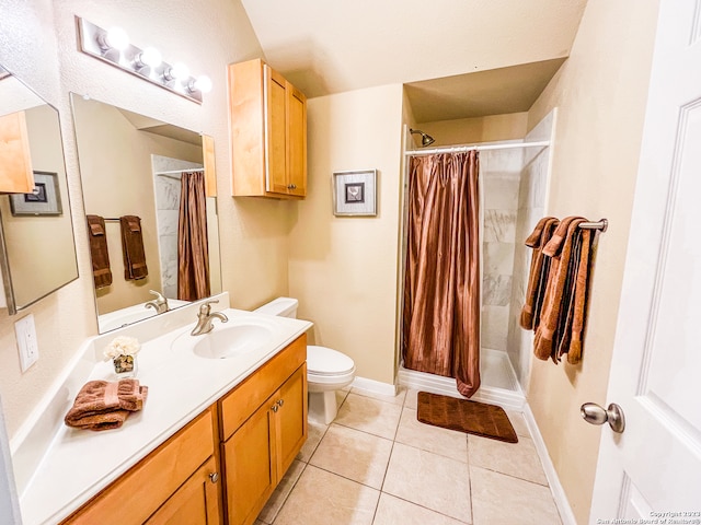 bathroom with toilet, vanity, a shower with shower curtain, and tile patterned flooring