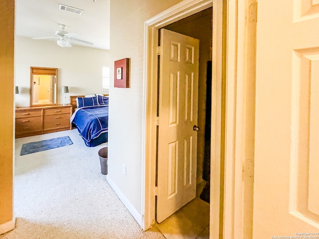 carpeted bedroom featuring ceiling fan