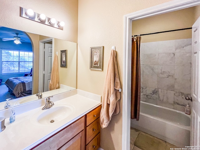 bathroom featuring vanity, ceiling fan, and shower / bathtub combination with curtain