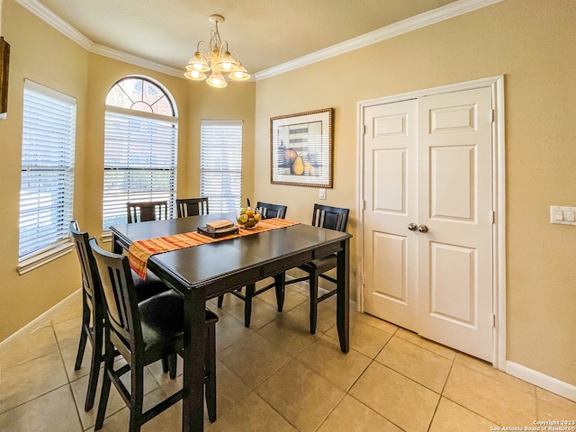 tiled dining space featuring a textured ceiling, an inviting chandelier, and crown molding