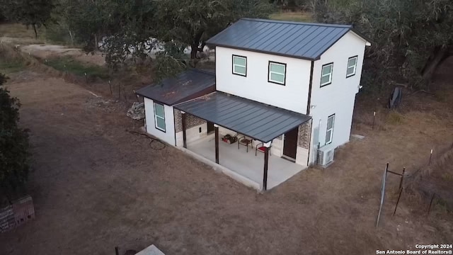 back of property with a patio area