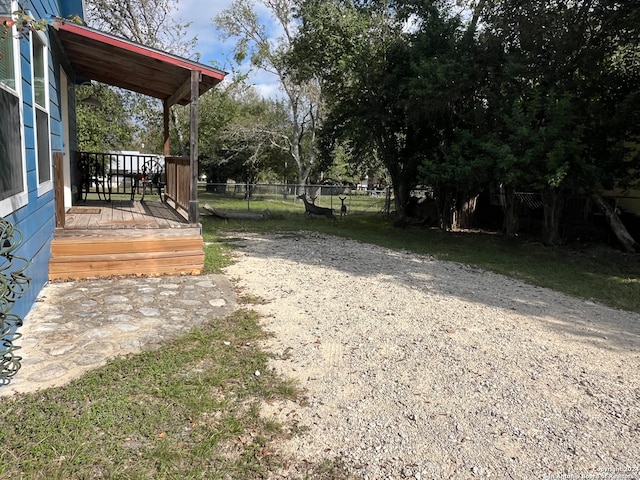 view of yard featuring covered porch