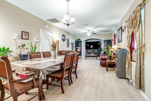 dining area featuring ceiling fan with notable chandelier and light hardwood / wood-style flooring