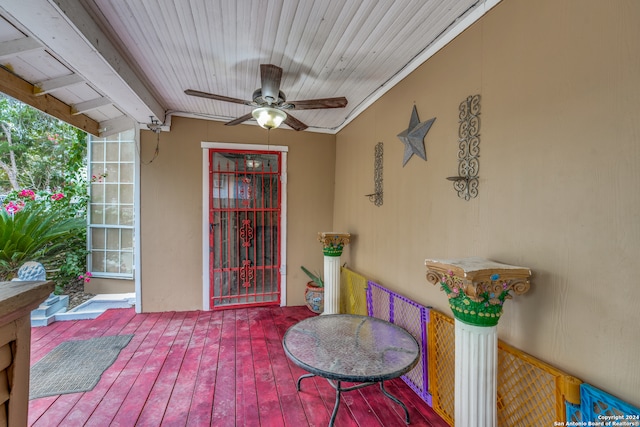 doorway to property featuring ceiling fan