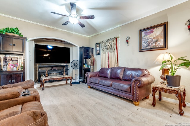 living room with ceiling fan, light hardwood / wood-style flooring, and crown molding