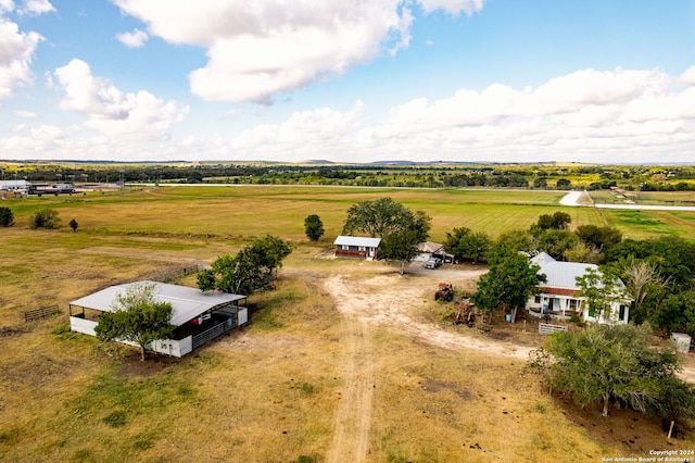 birds eye view of property with a rural view