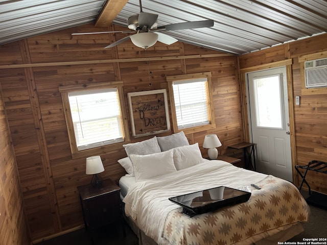 bedroom with ceiling fan, wooden walls, lofted ceiling with beams, and a wall mounted air conditioner