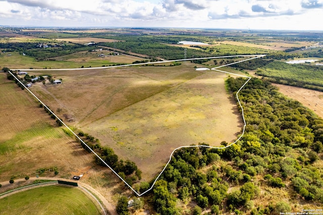 birds eye view of property featuring a rural view