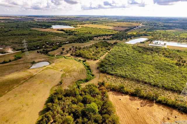 drone / aerial view with a water view and a rural view