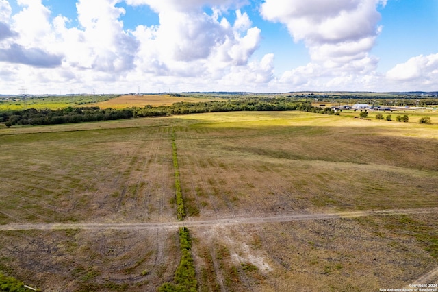 birds eye view of property with a rural view