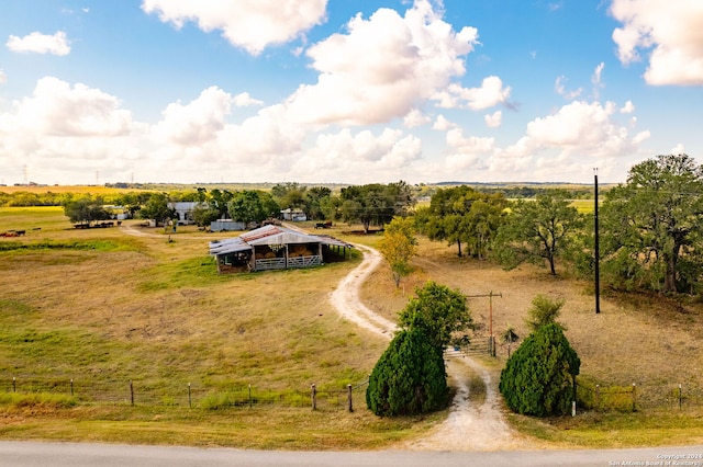 birds eye view of property featuring a rural view