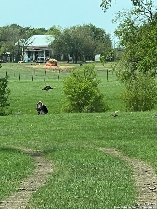 surrounding community featuring a lawn