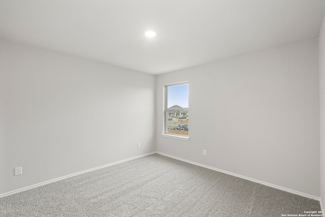 unfurnished room with carpet floors