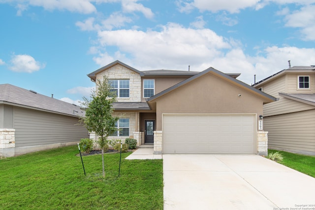 view of front of house with a garage and a front lawn