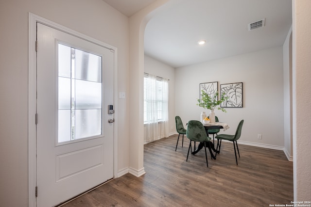 dining area with dark hardwood / wood-style flooring