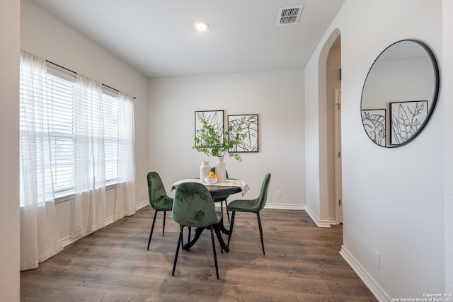 dining space with dark wood-type flooring